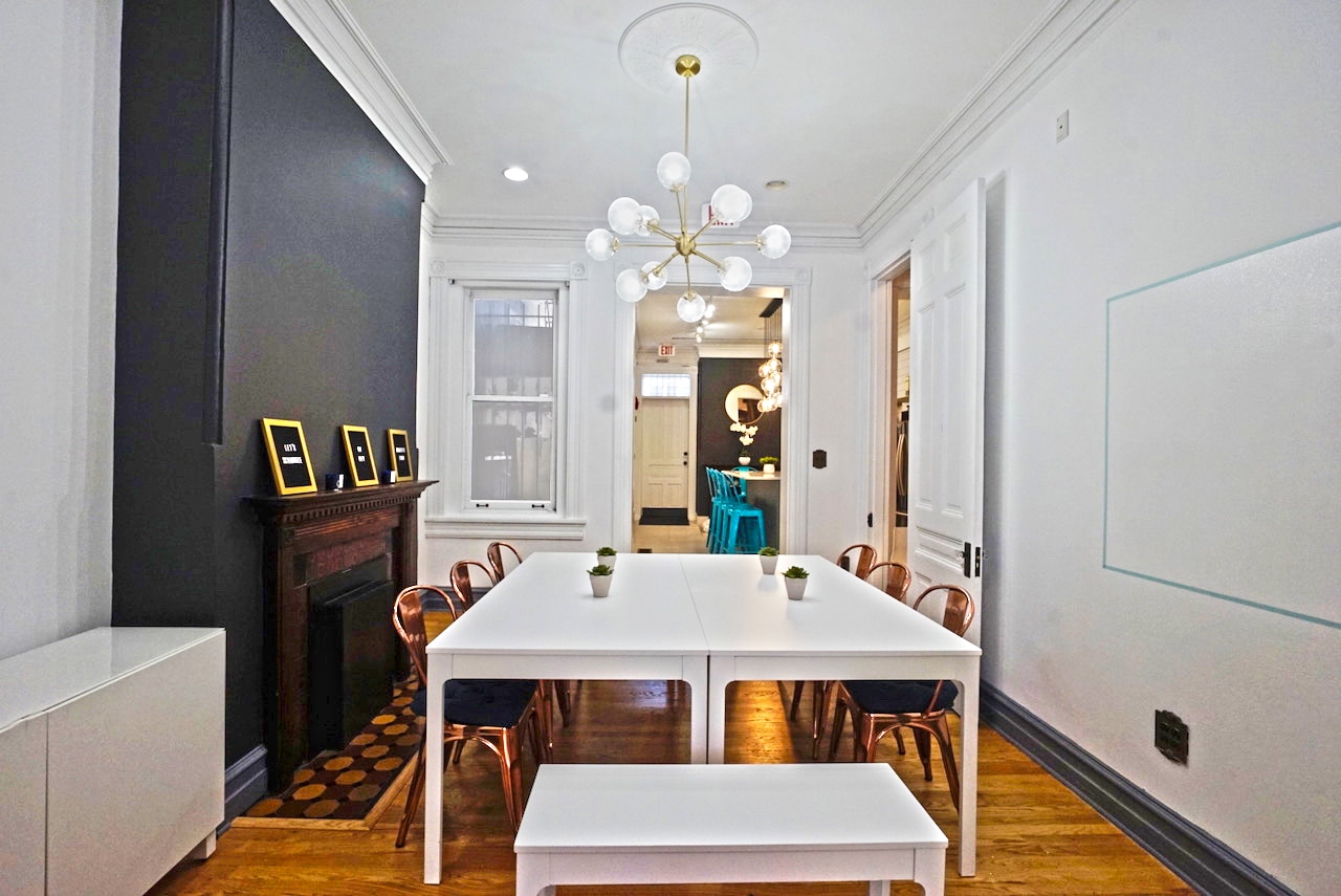 Gather's dining / conference room, adjoining the kitchen and living room. 