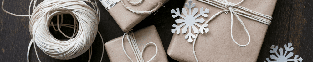 Wrapped gifts decorated with snowflakes.