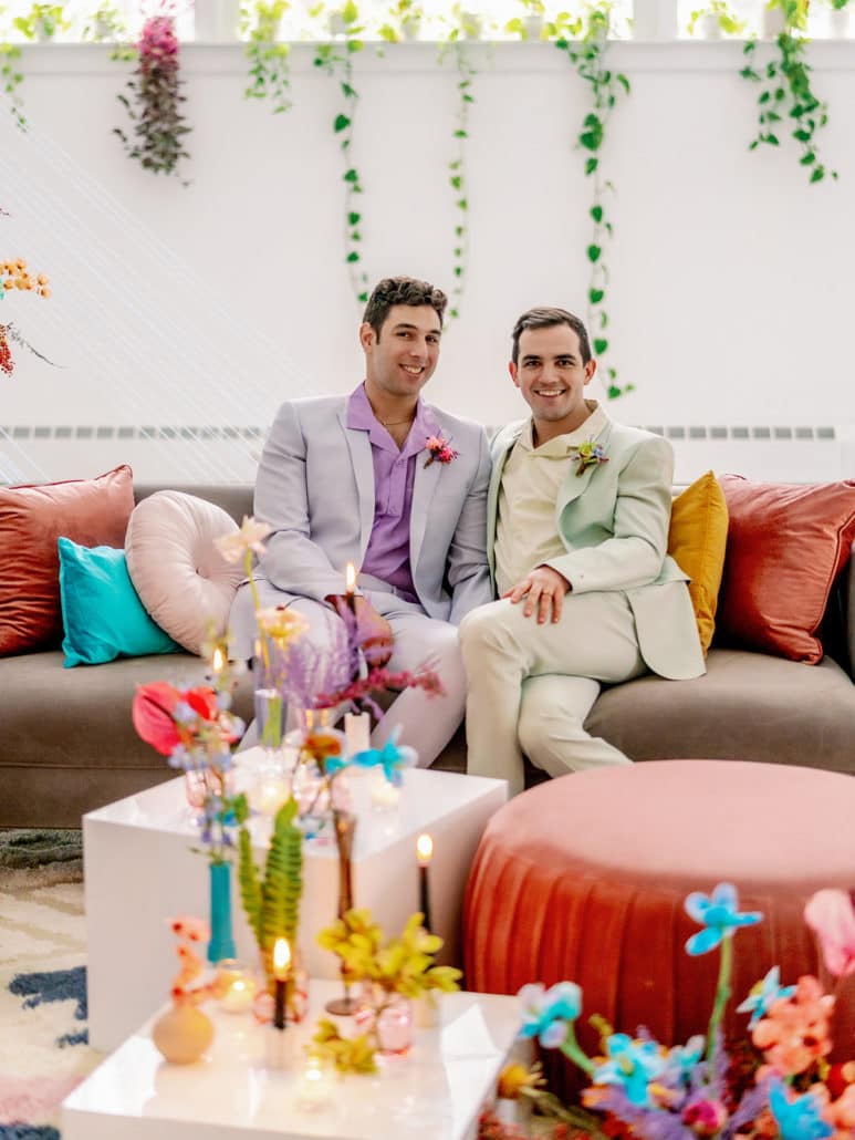 David Lloyd Olson and his husband, Jonah, pose together at their friend's wedding venue. 
