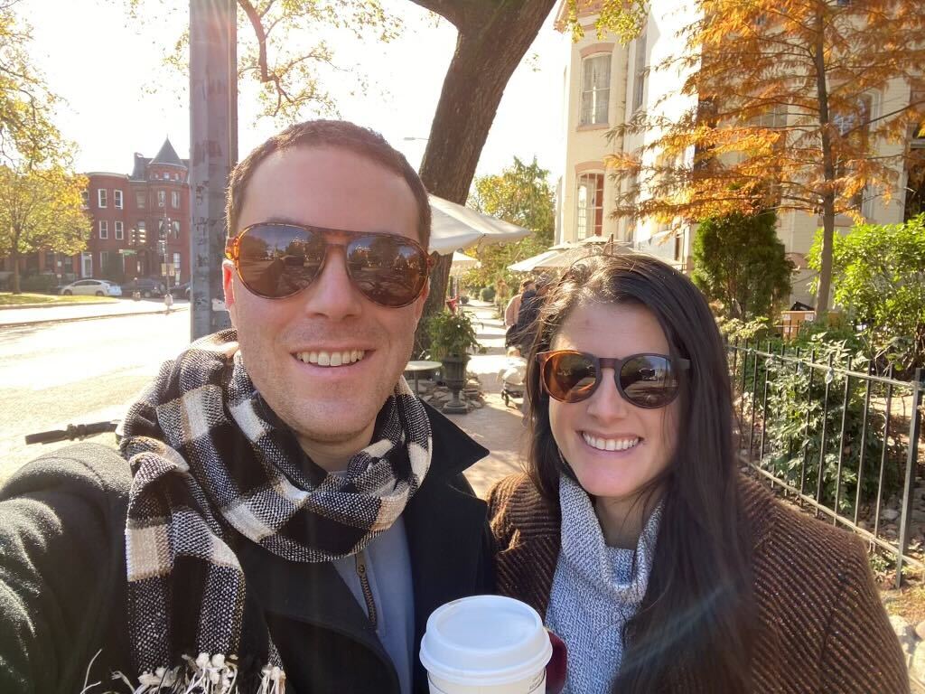 Rachel and Cory take a selfie on a wintry day, to go cups in hand. 