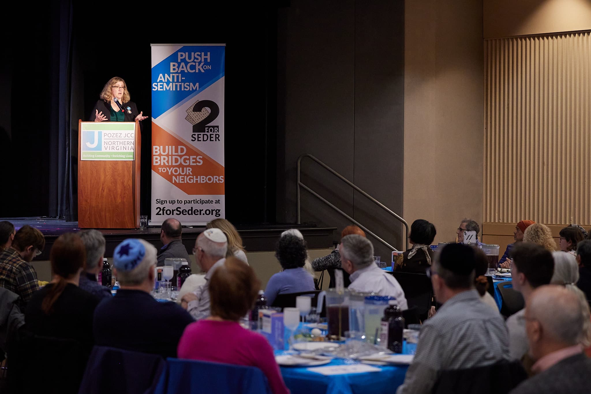 Marnie Fienberg speaks at the NoVA Community Seder in March 2023. 