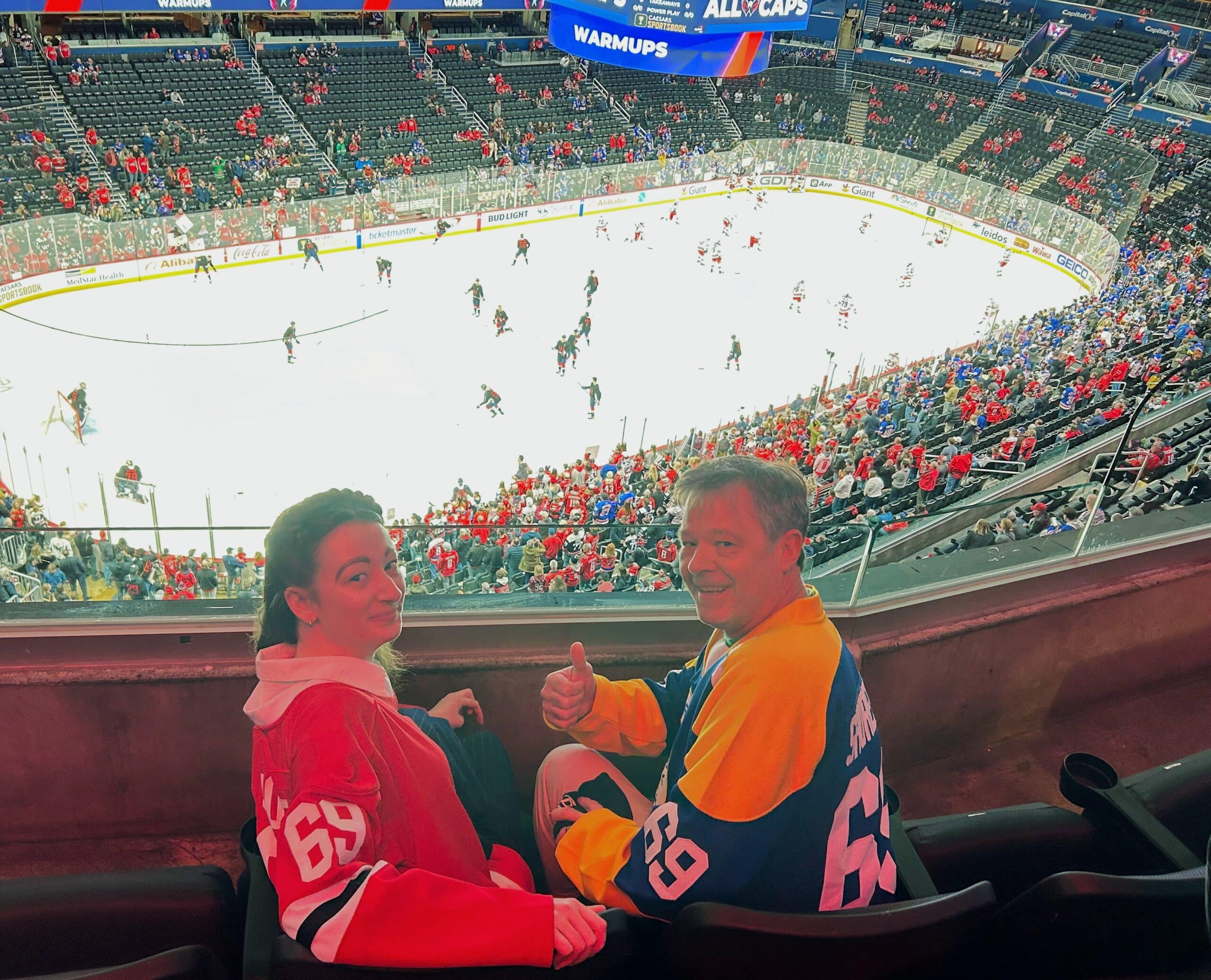 Lane with a friend at the Caps - Rangers game. 