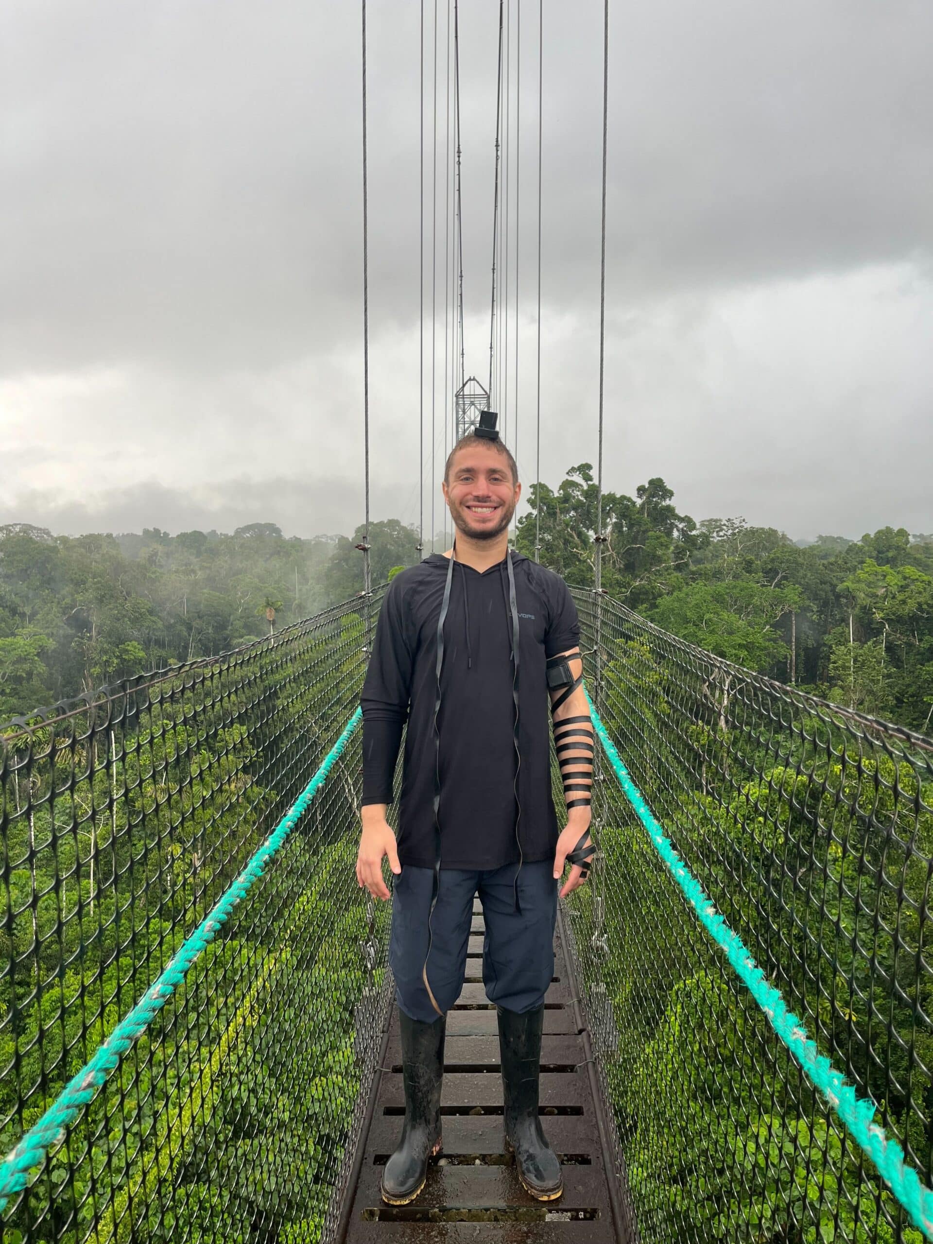 Zach, wearing tefillin in the rainforest in Ecuador. 