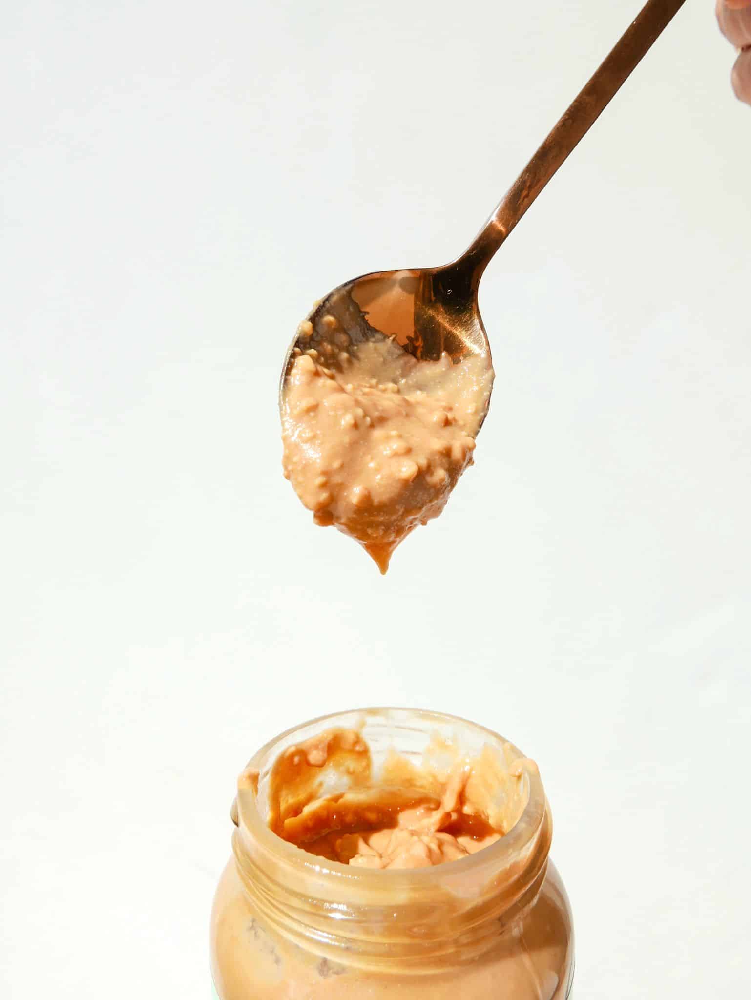 Crunchy peanut butter on a spoon. 