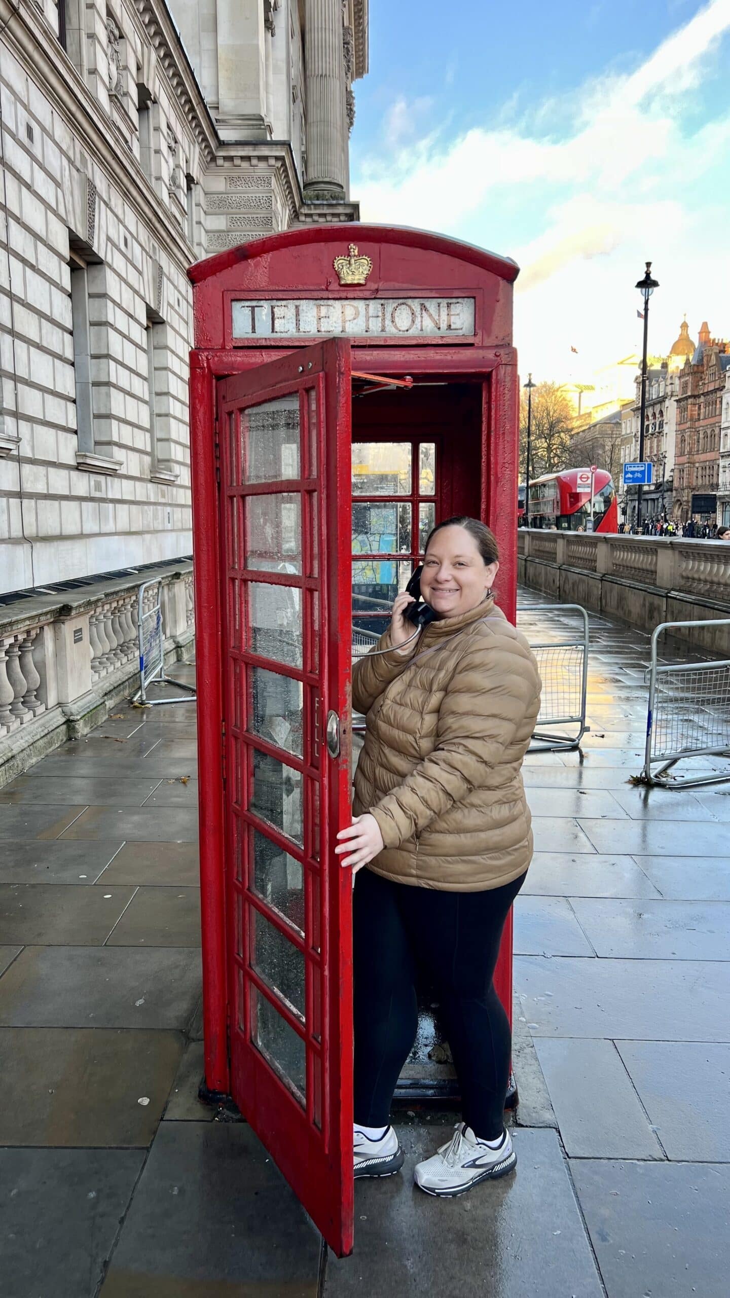 Arielle in London, in a phone booth. 