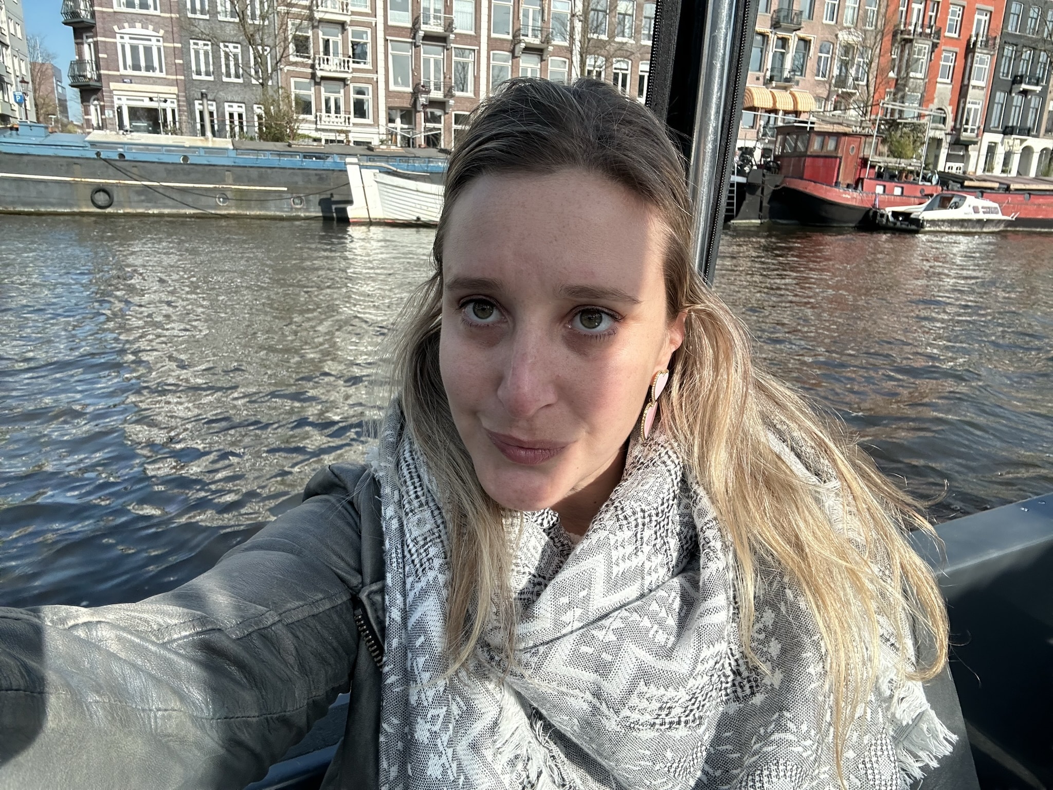 Lisa takes a selfie on a canal boat. 