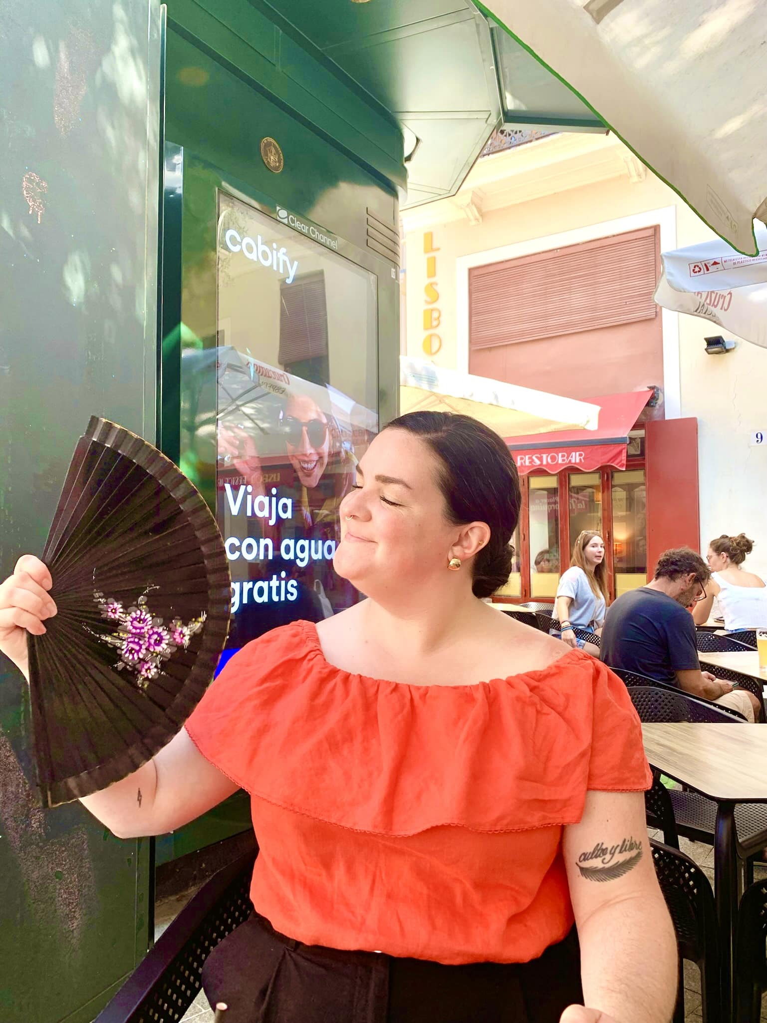 Sarah with a hand fan. 