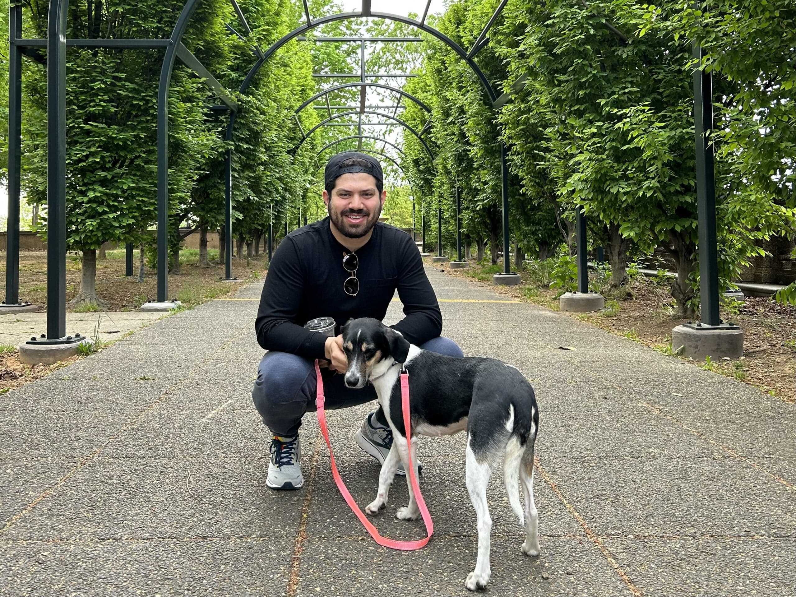 Jordan and a dog in a park. 