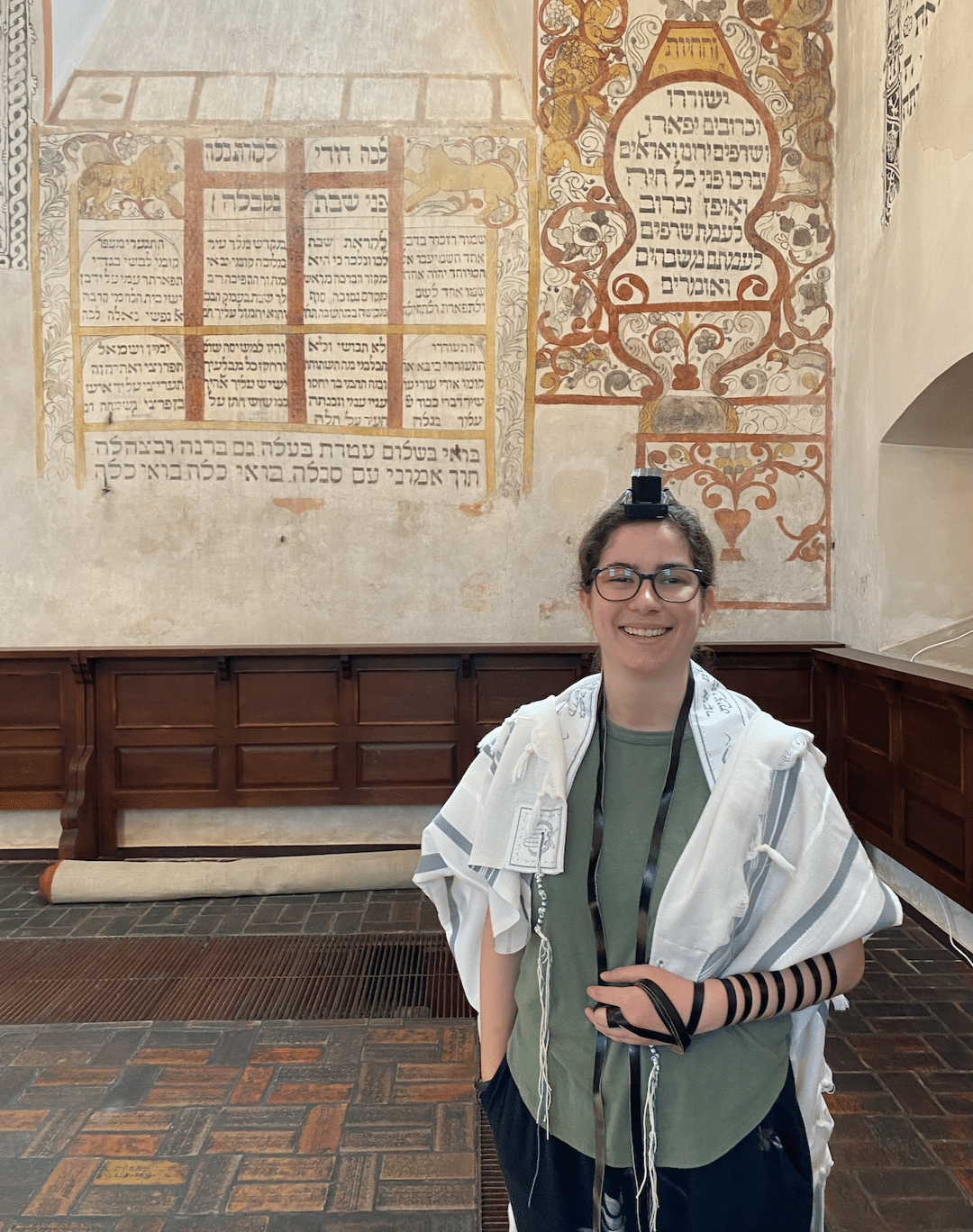 Hadar wrapping tefillin.