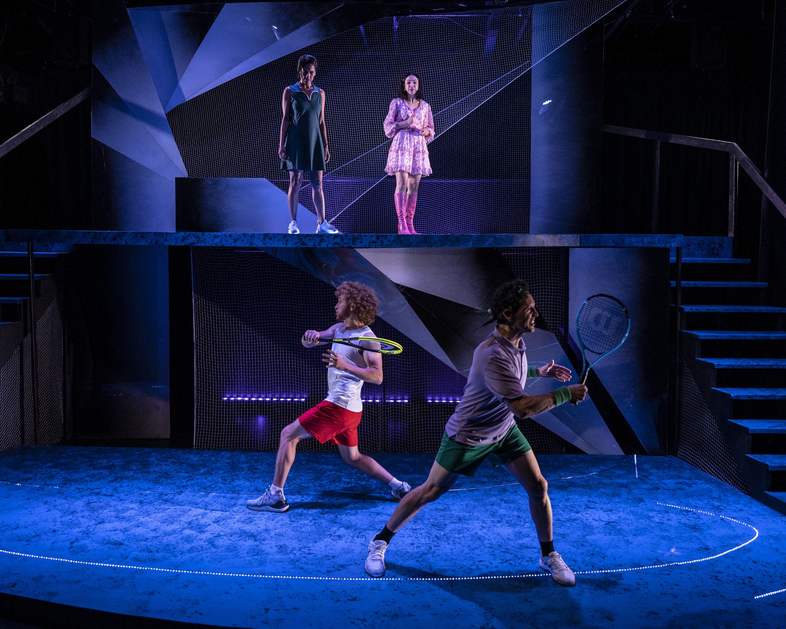 Ethan playing tennis onstage in a production of The Last Match.