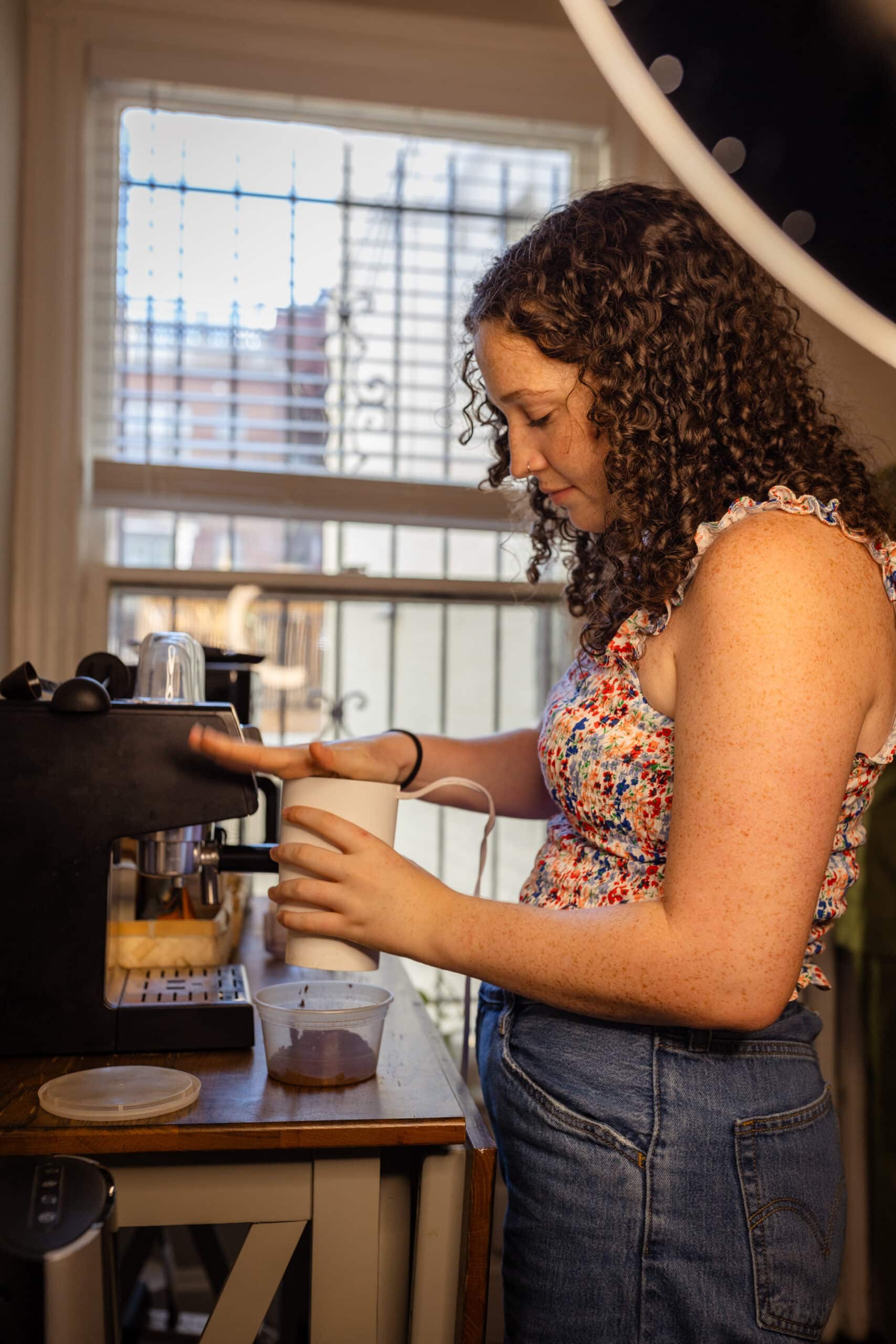 Ellen making coffee.