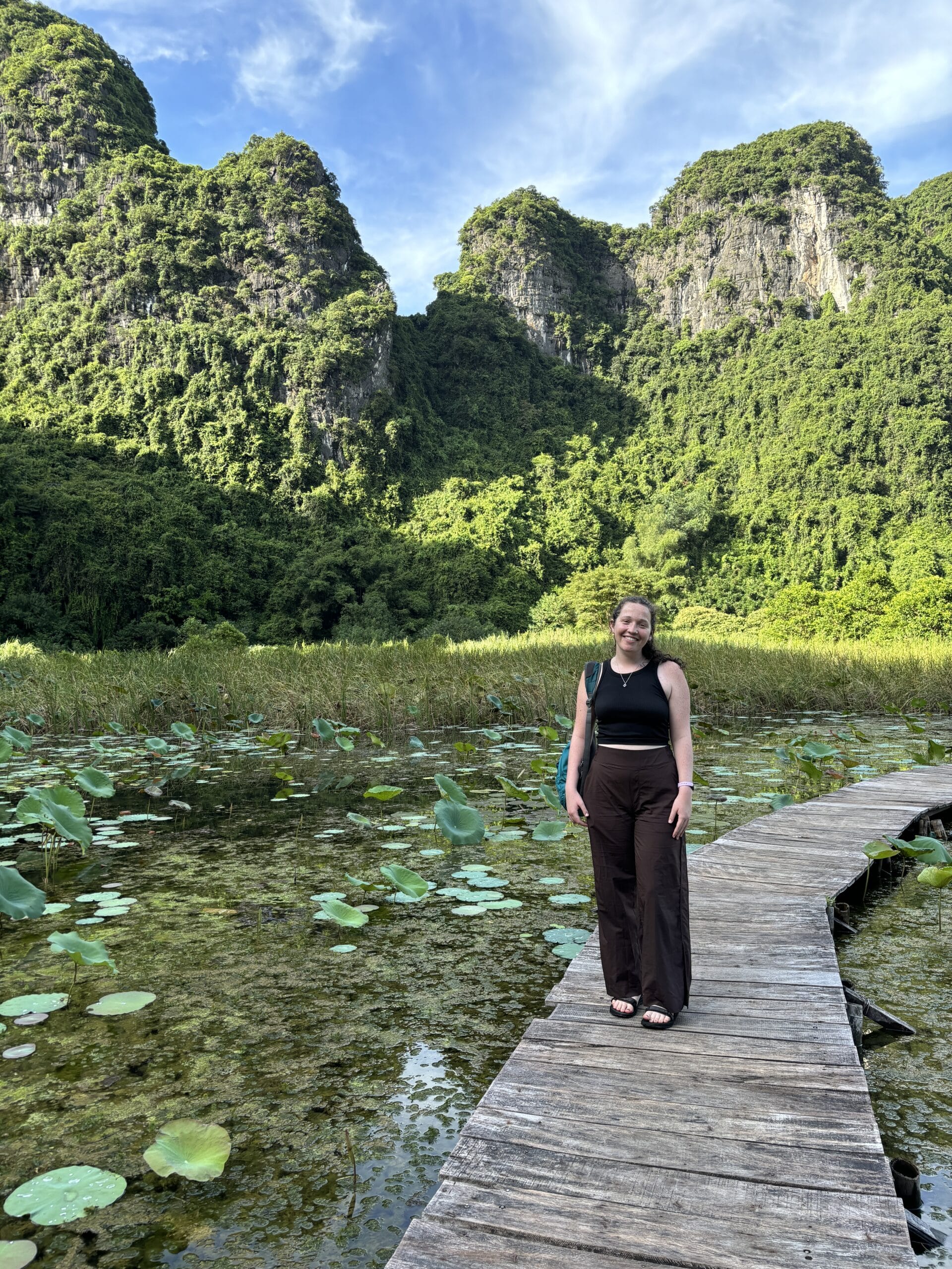 Ellen on a lake covered in lily pads.