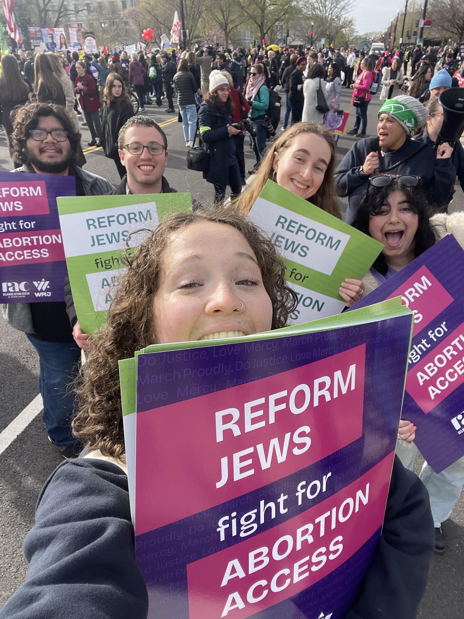 Ellen at a rally for abortion rights with a sign reading "Reform Jews fight for abortion access"