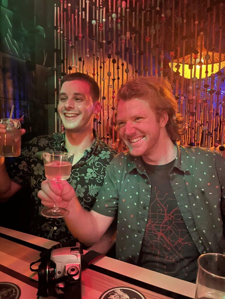 Ethan and a friend at a bar.