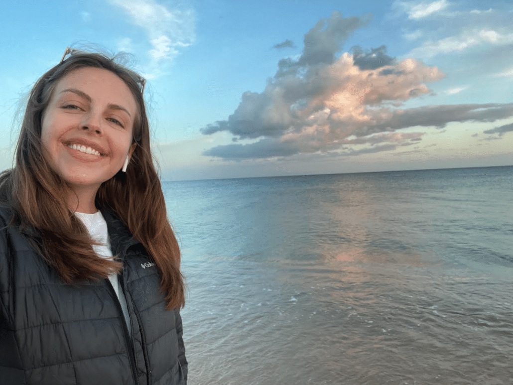 Isabel in front of the ocean.