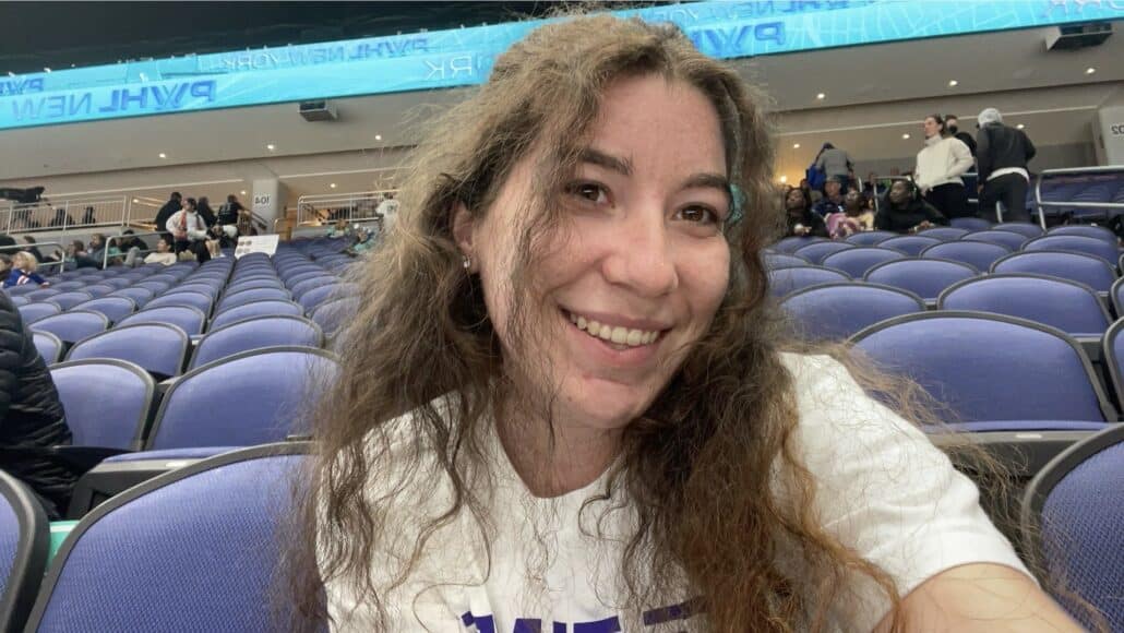 Shannon takes a selfie at a hockey game. 