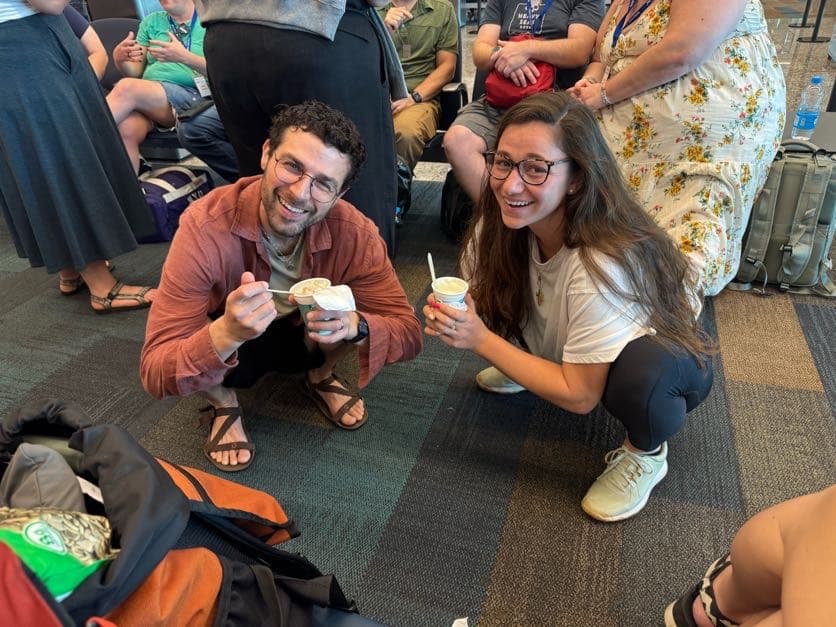 Naomi in an airport with HMI folks.