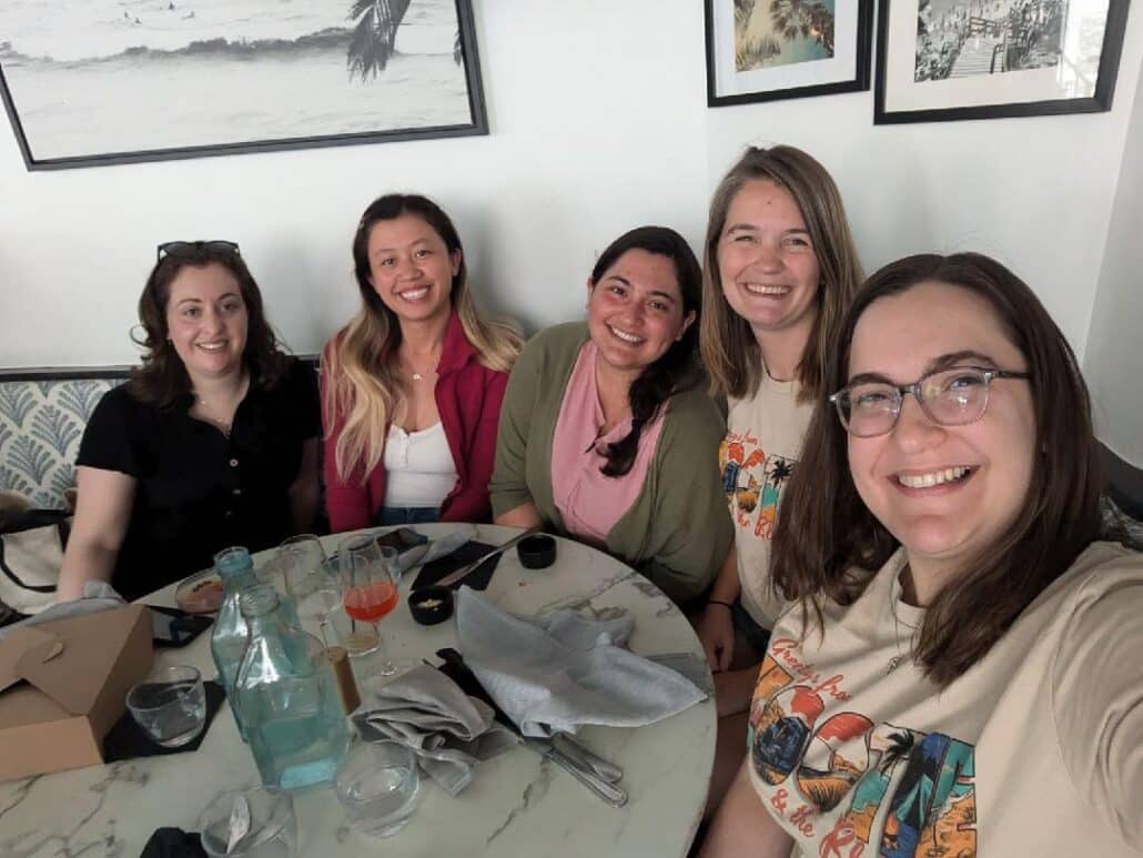 Emma and friends around a table.