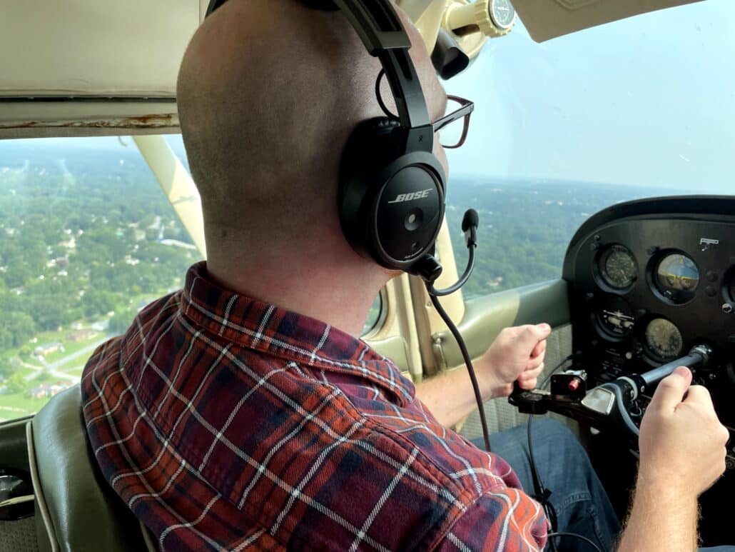 Richard in a small airplane.