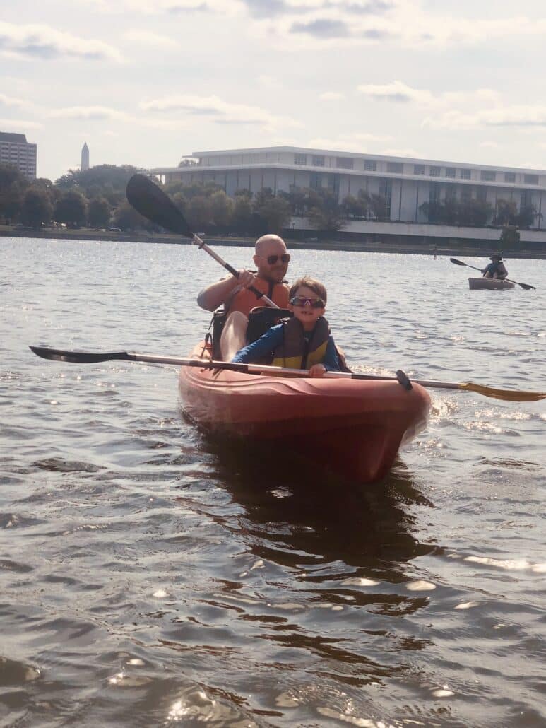 Richard and his son in a kayak.