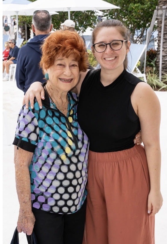 Hally and an older woman in a colorful blouse.