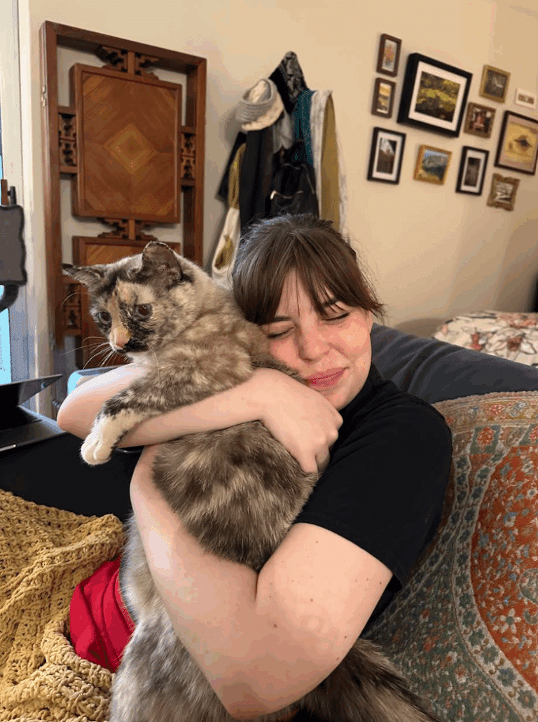Claire holding her cat.