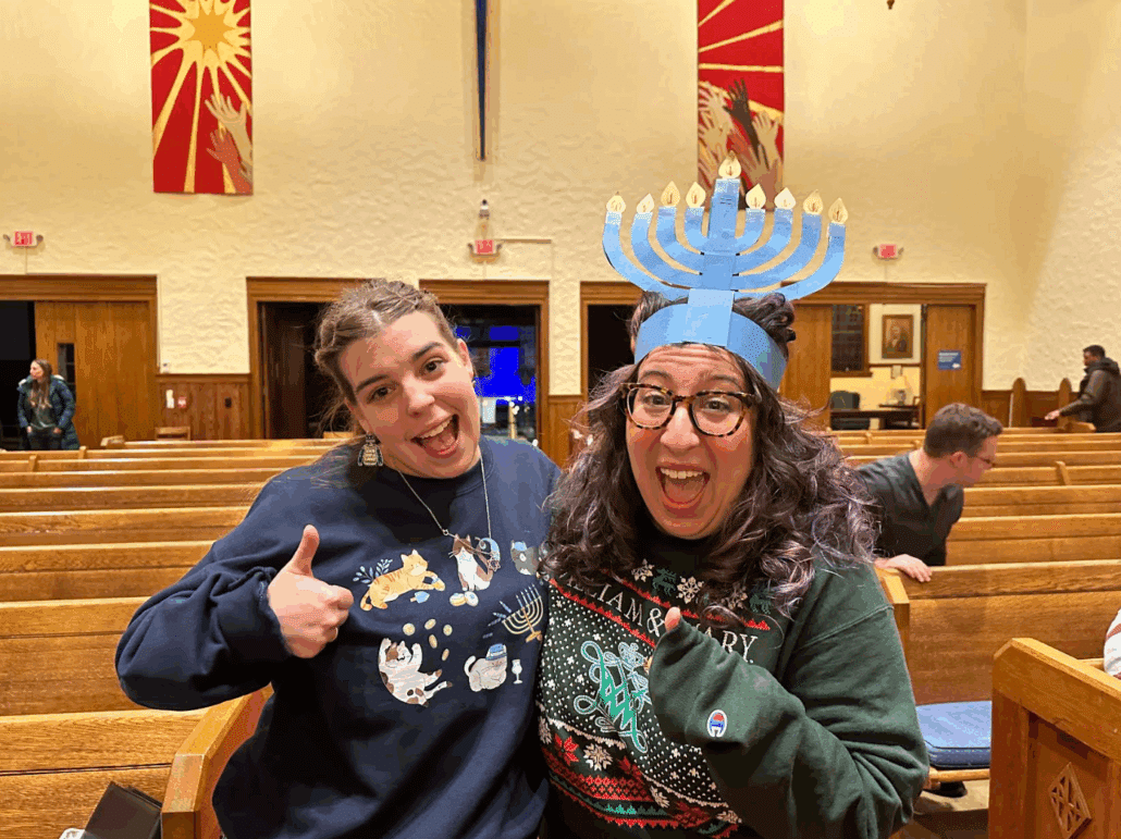 Claire and a friend at a Hanukkah event.