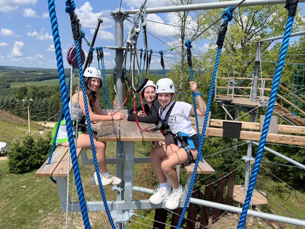 Hannah on a ropes course.
