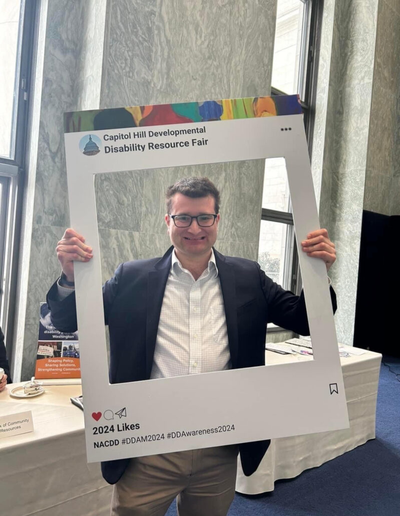 Andrew at a conference for disability advocacy. 
