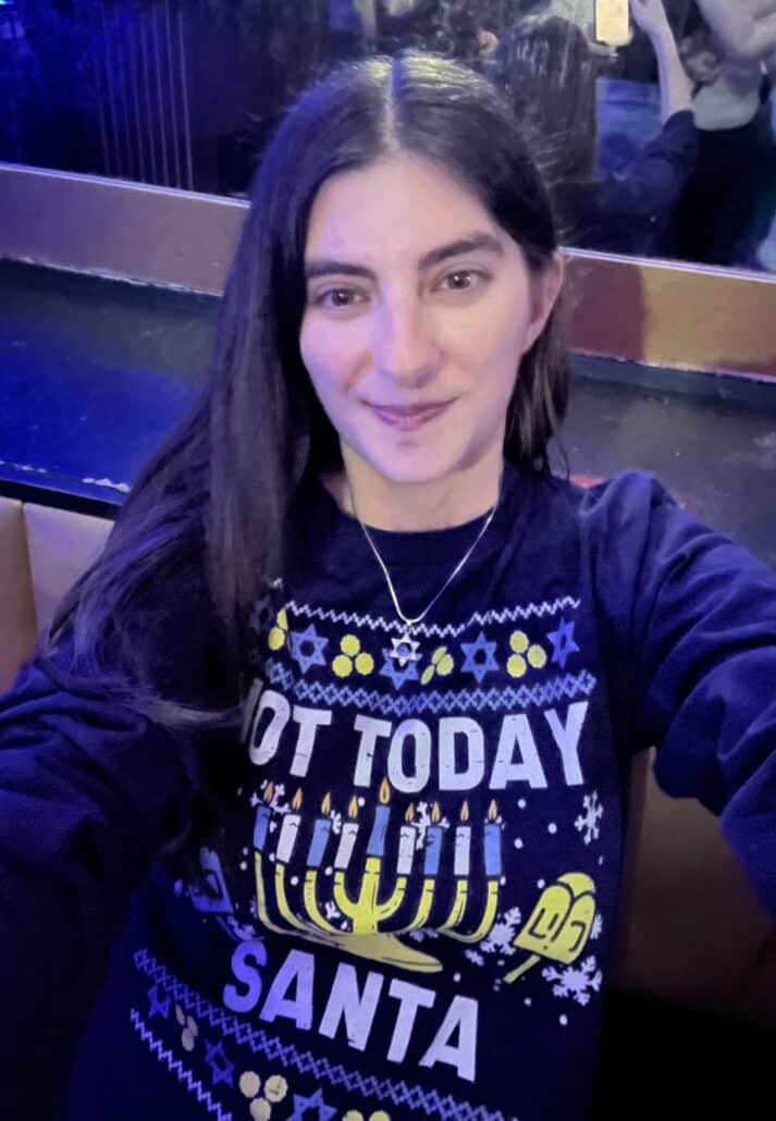 Rachel in a Hanukkah sweater.
