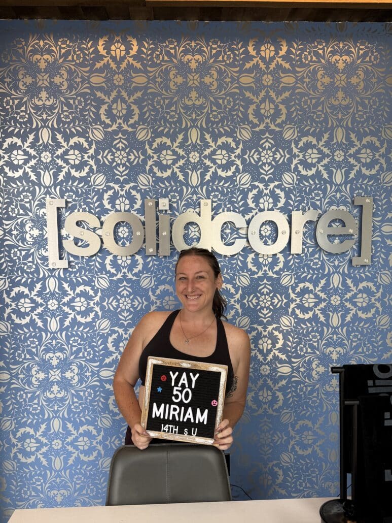 Miriam celebrating 50 solidcore classes.