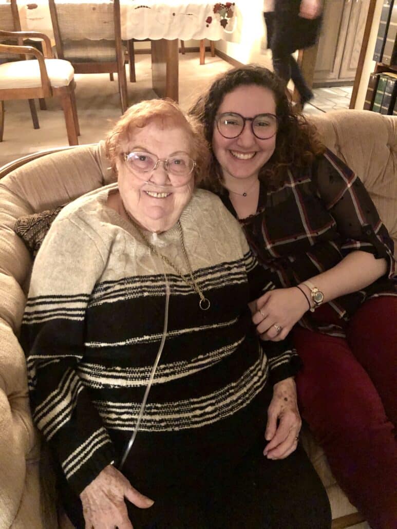 Melissa and a grandparent smiling.