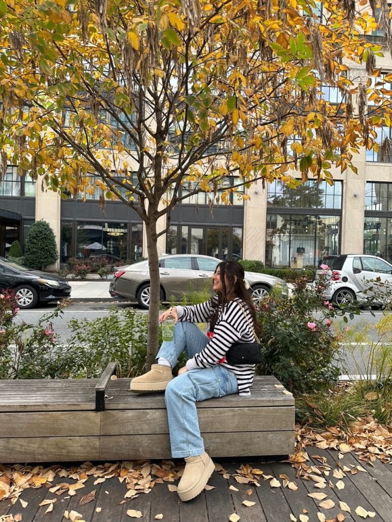Samantha sitting on a park bench.