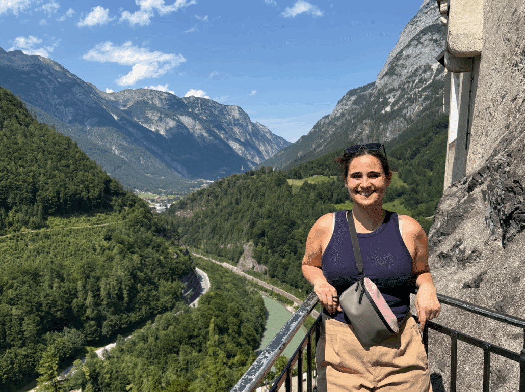 Aliyah on a balcony overlook of a wooded valley.