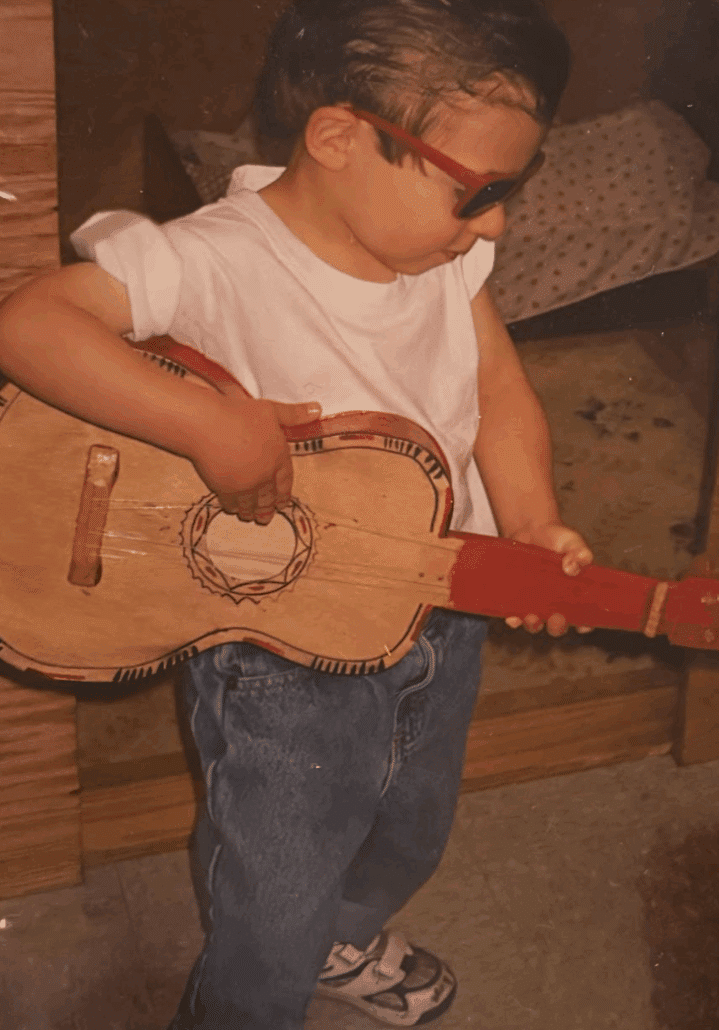 Child Noah plays guitar.