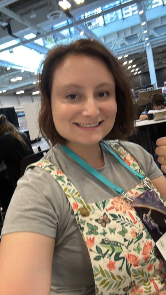 Juliet in a floral apron.