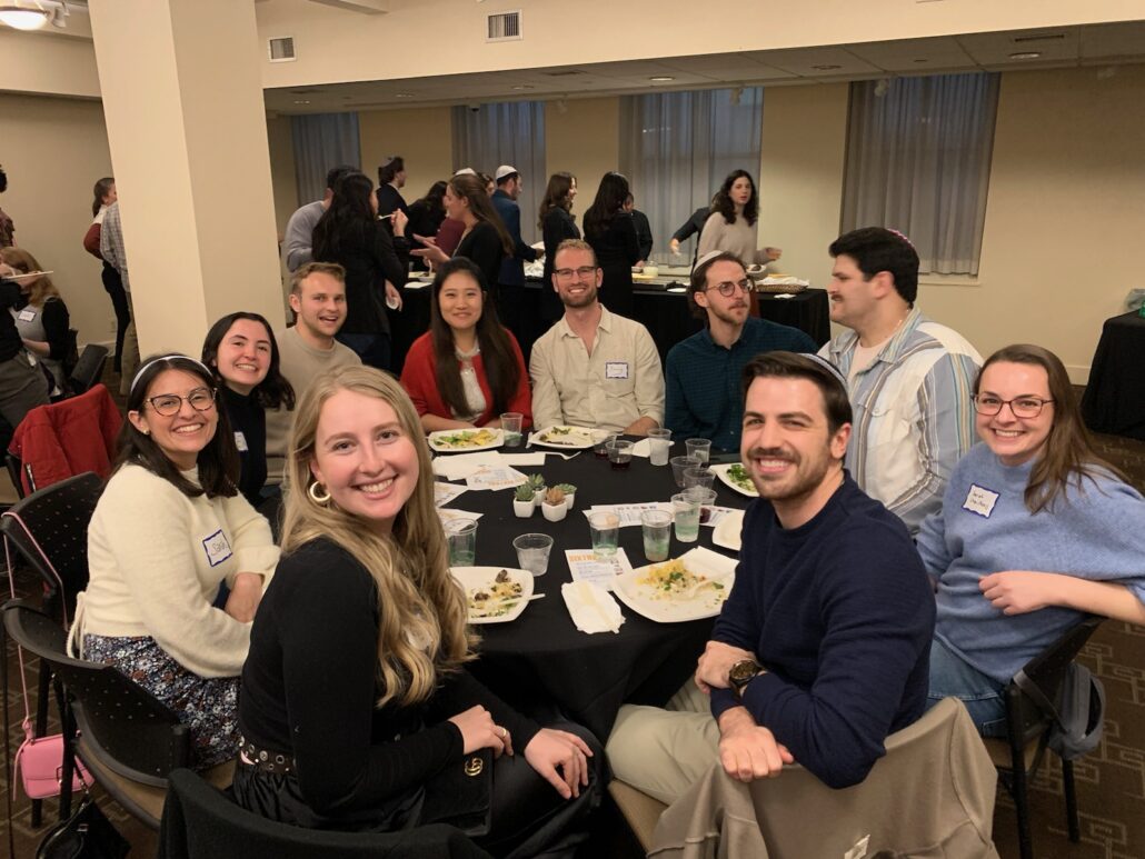 Jake at a large dinner with friends.