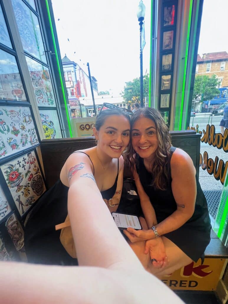 Emma in a tattoo parlor.