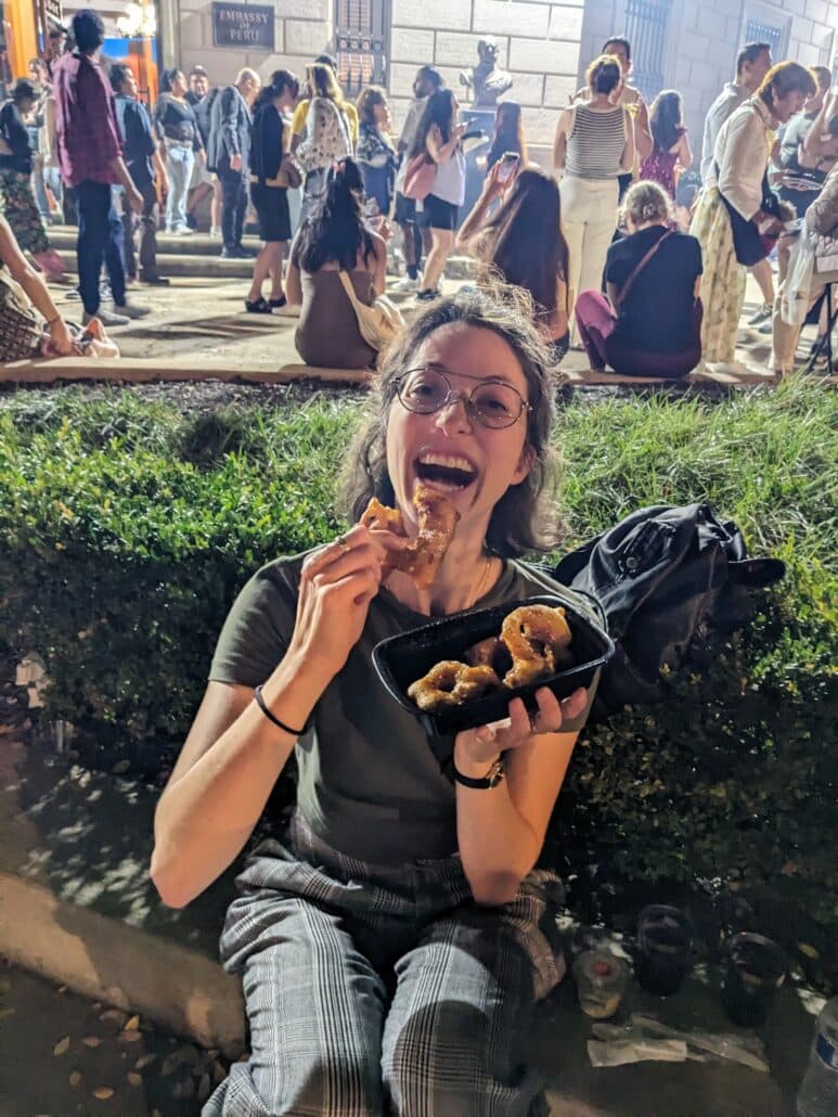 Tamar eating fried dough near the Peruvian embassy.