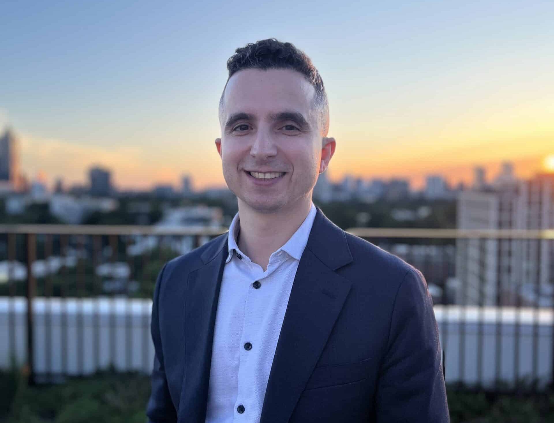 Ethan in a blazer at sunset.