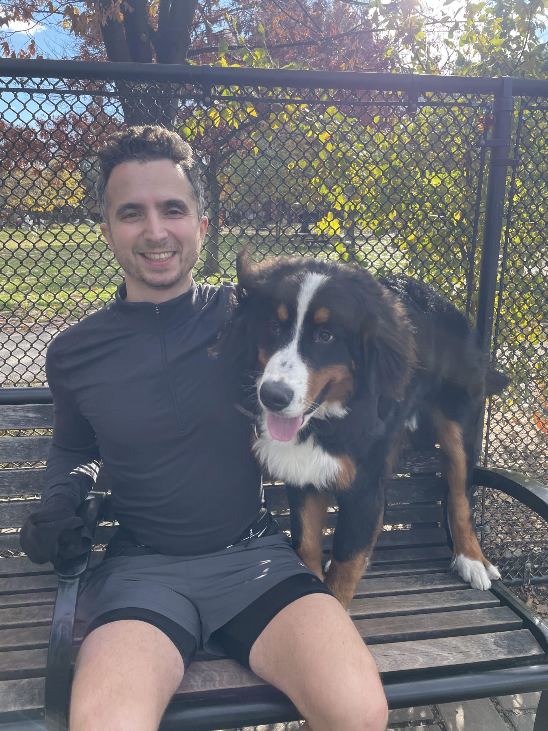 Ethan and a dog on a bench.