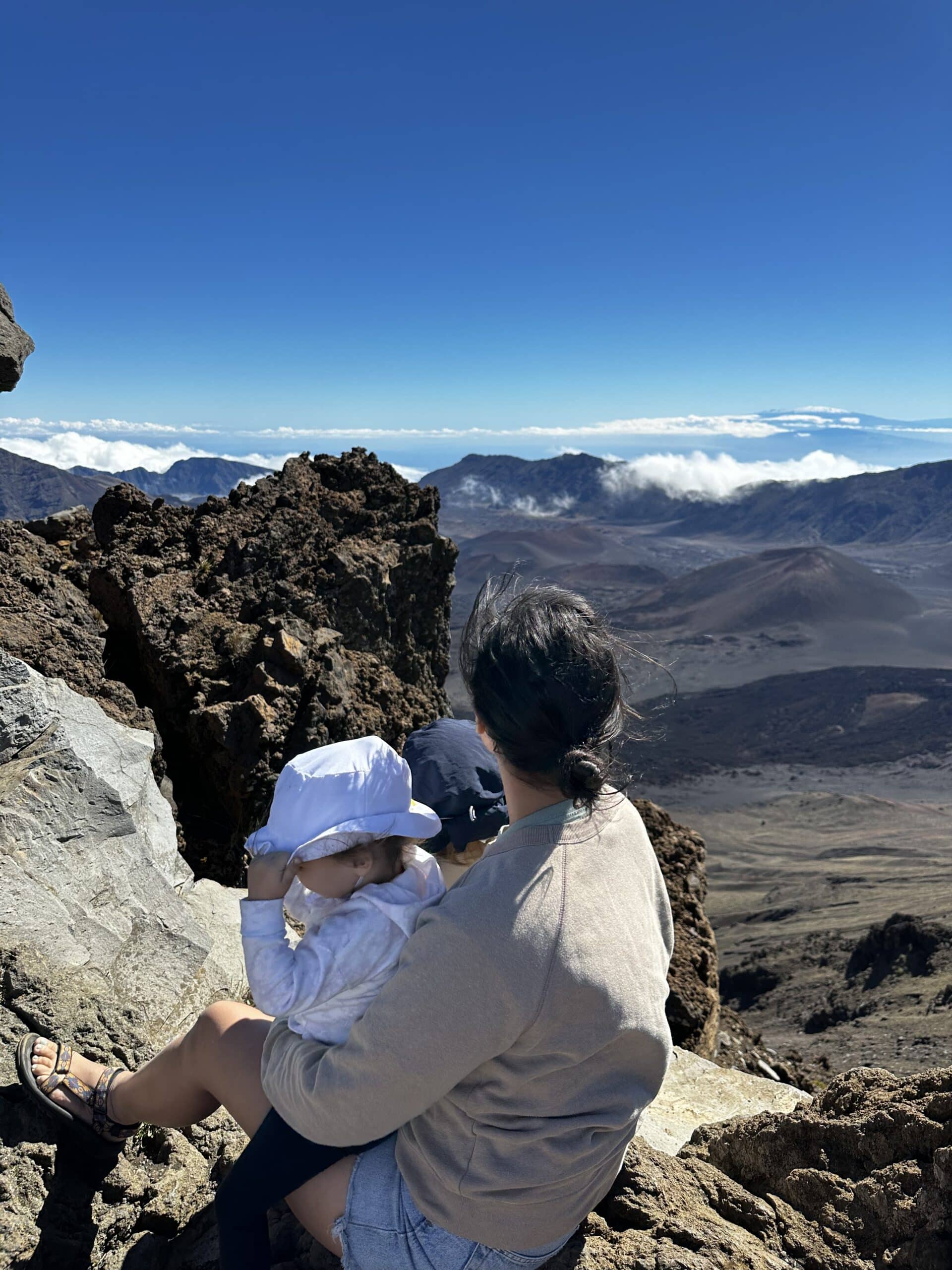 Nina and her two children on a cliffside.