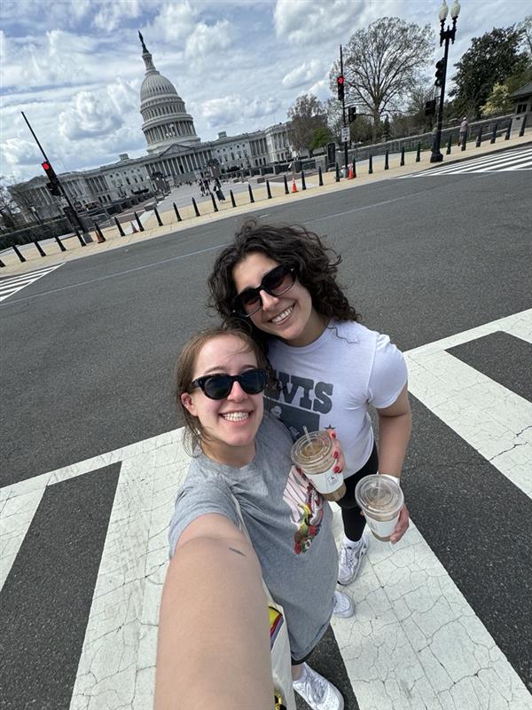 Sophie and a friend in a crosswalk near the Capitol.