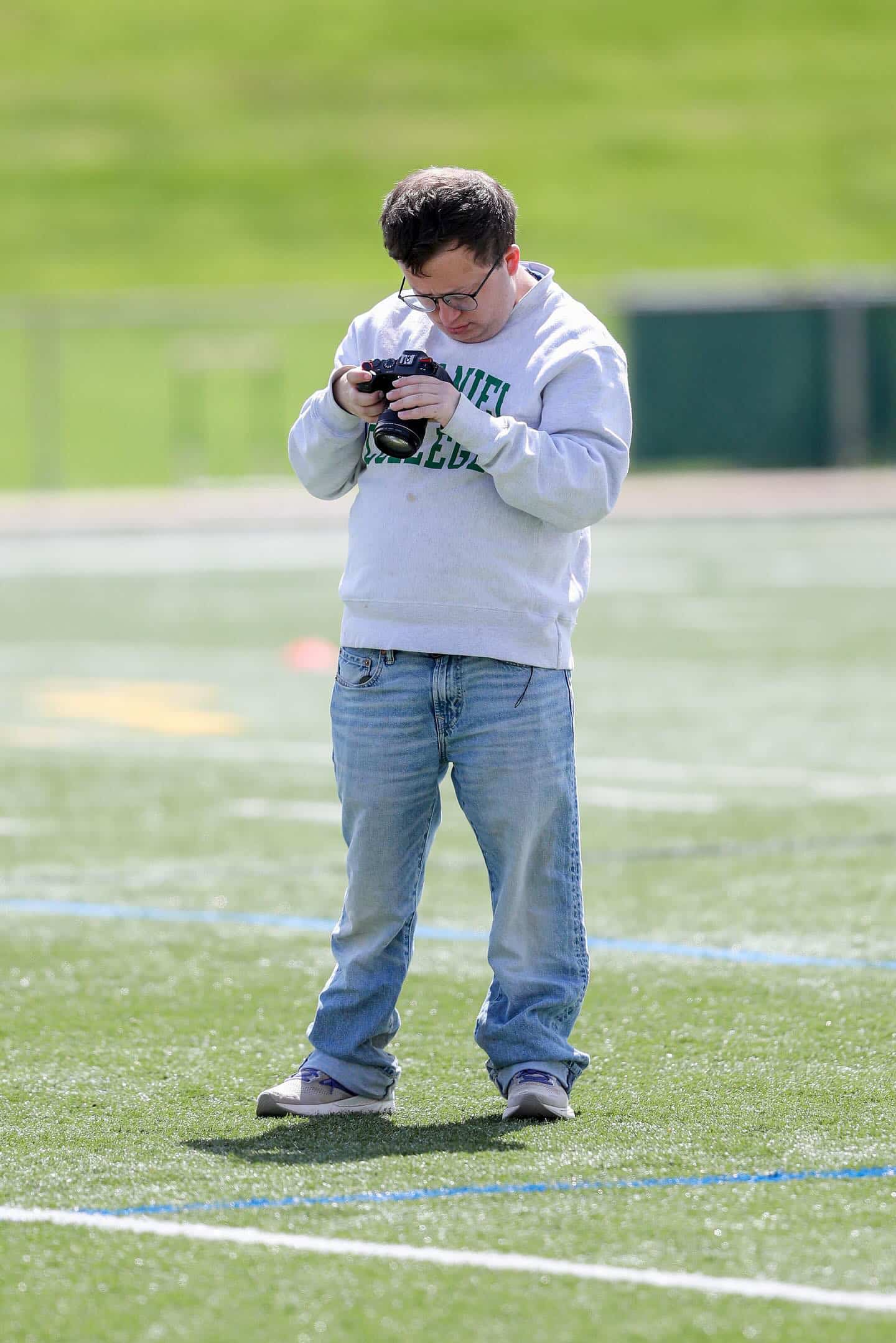 Jeremy looking at his film camera.