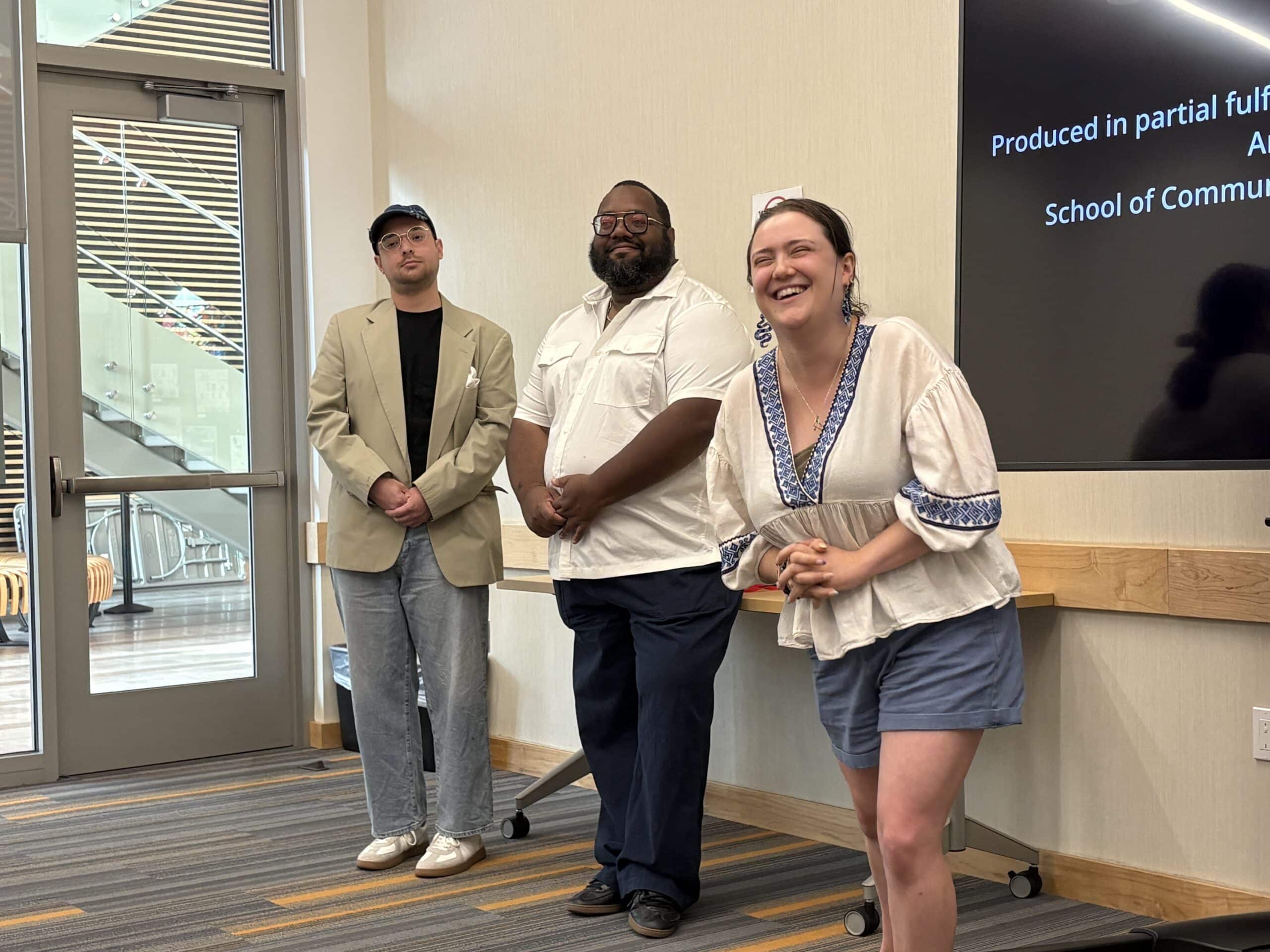 Samantha and friends giving a presentation.