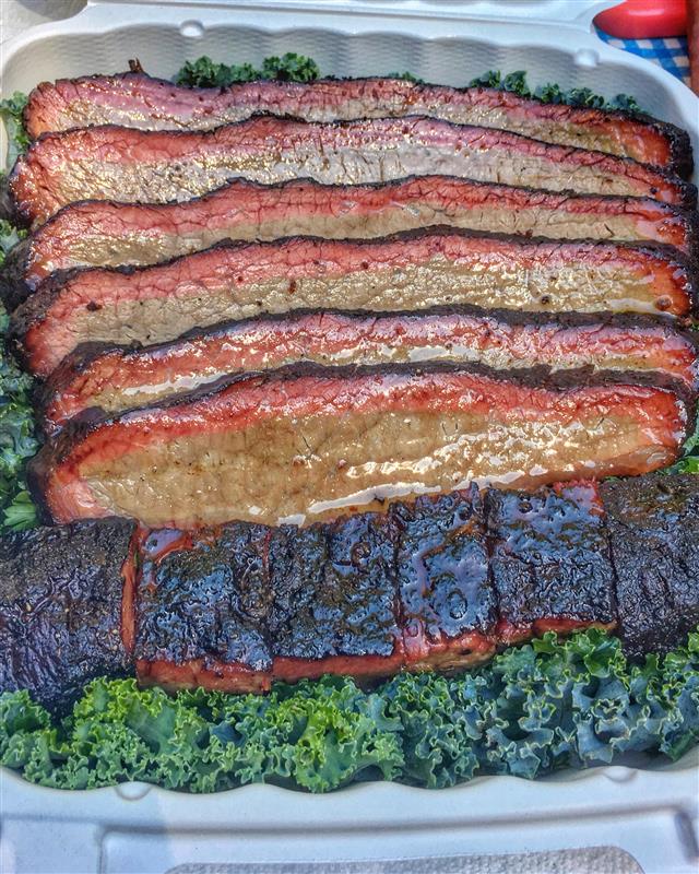 Barbecue in a to-go clamshell. 