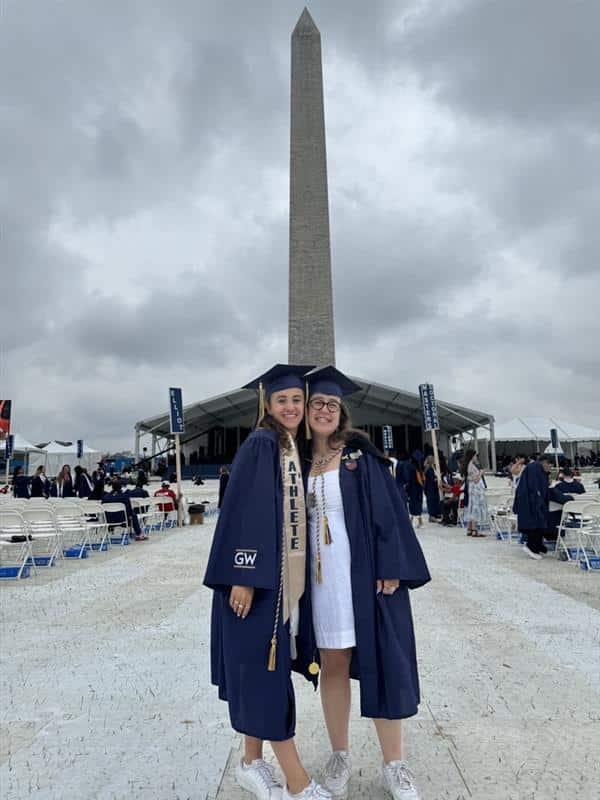 Sophie at graduation beneath the Washington Monument.