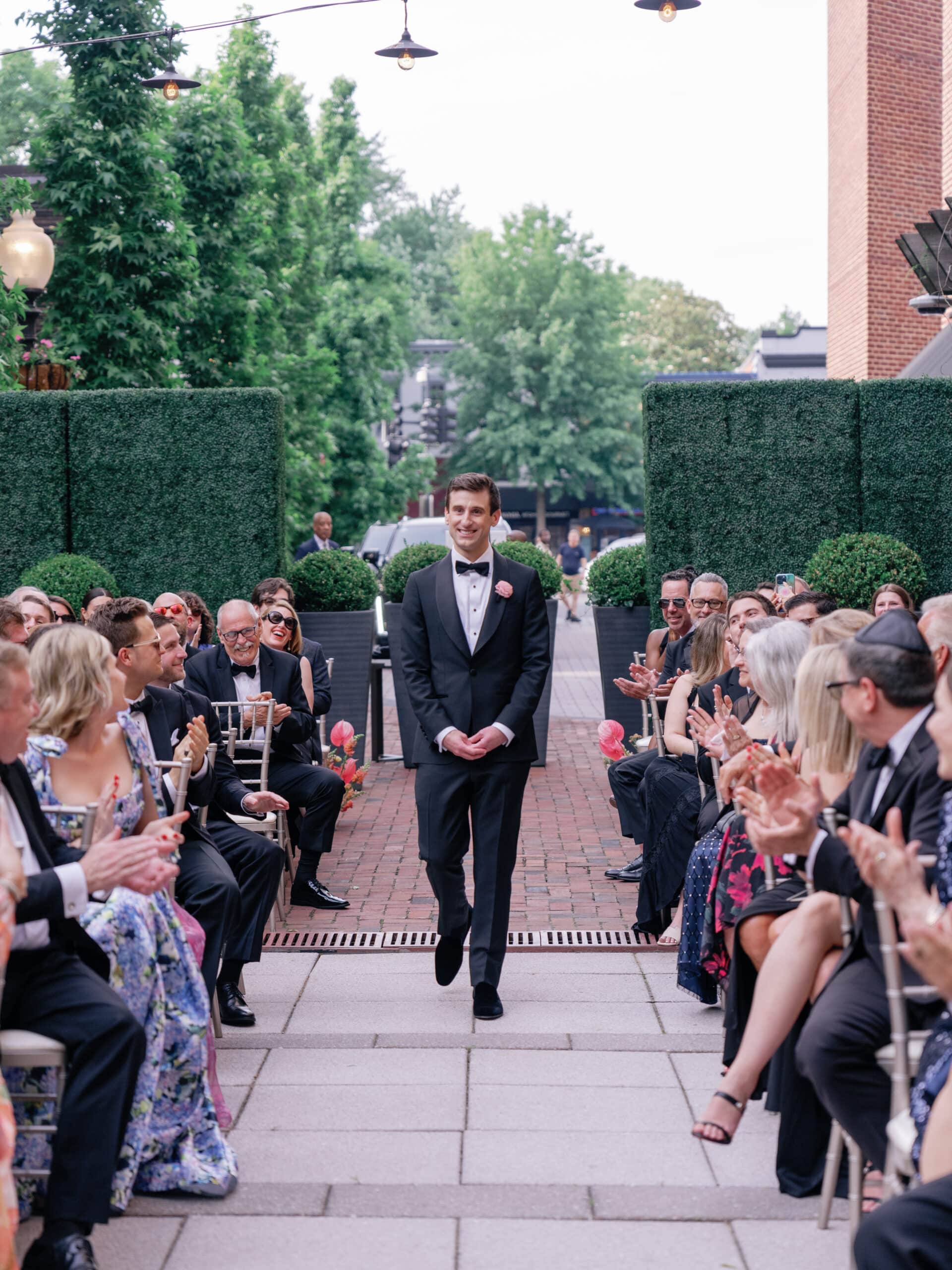 Nick walks the aisle at his wedding.