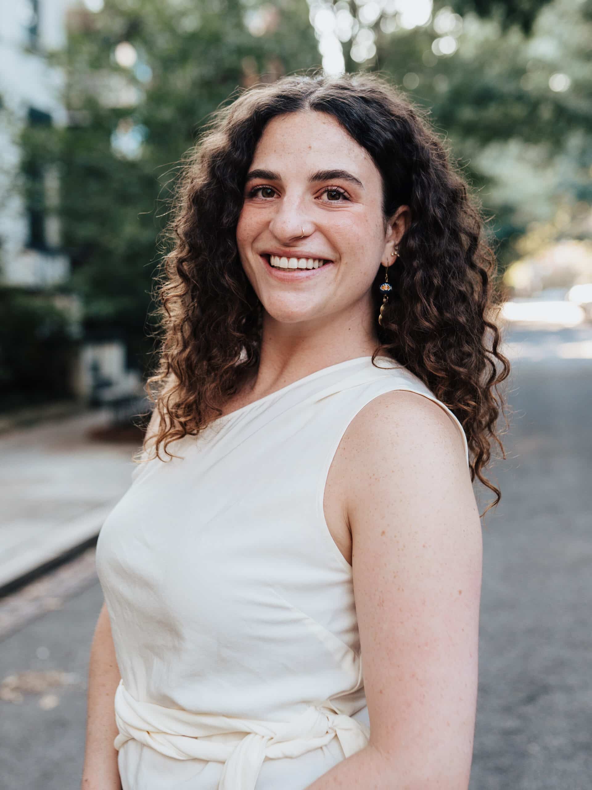 Rachel in a white dress.